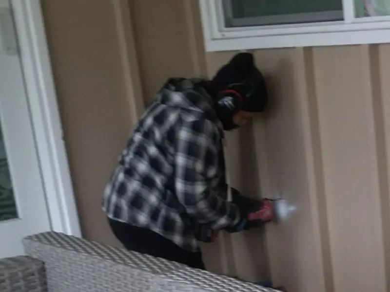 Professional electrician installing an exterior outlet in Colville