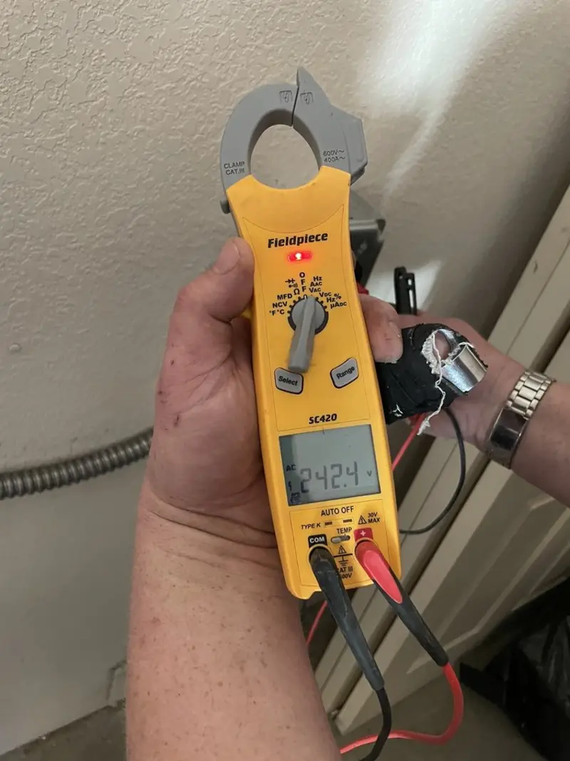 Voltage testing with clamp meter during Circuit Breaker Repair in Colville